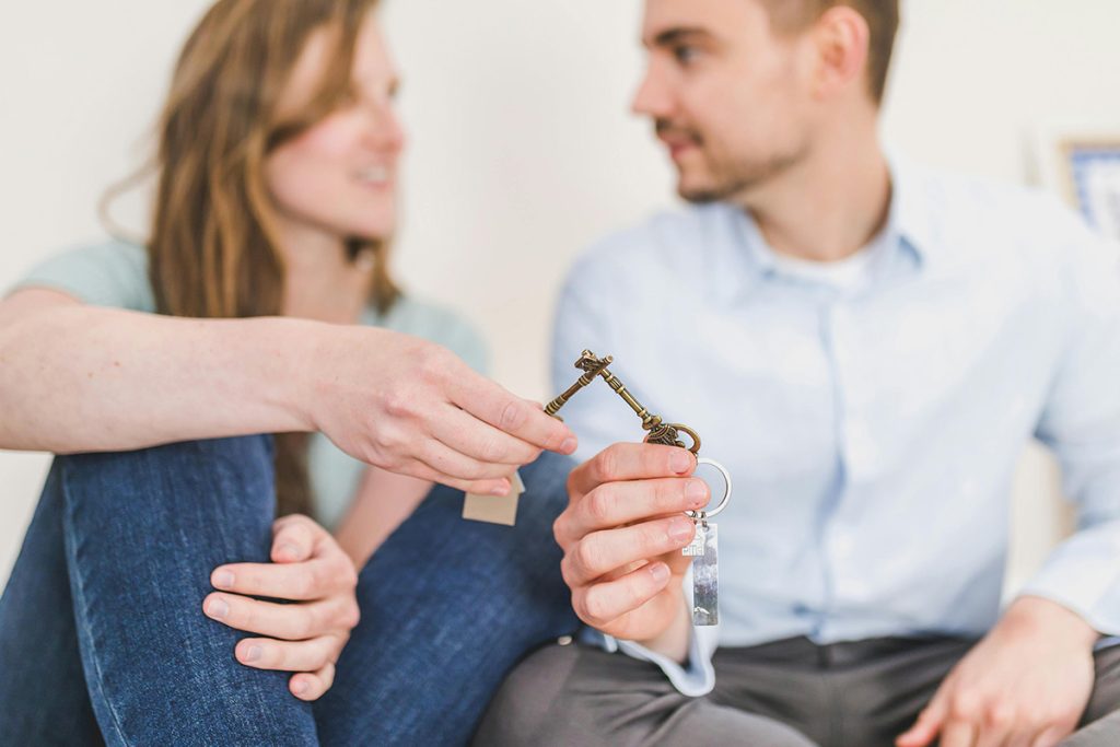 A couple with the keys to a second property
