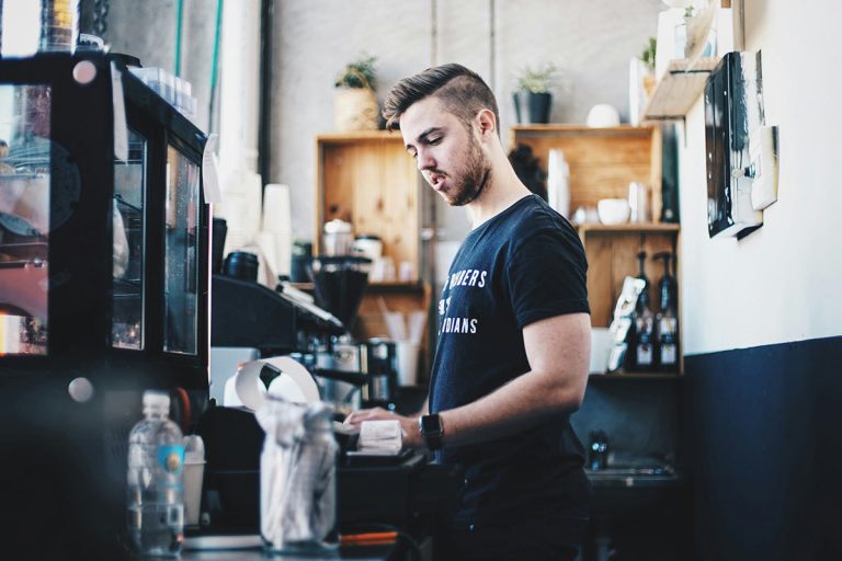 Young man working in Cafe